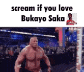 a man without a shirt is standing in front of a crowd with the words scream if you love bukayo saka above him