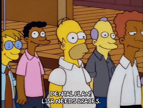 GIF of Homer Simpson rembering to fight for the dental plan for Lisa's braces.