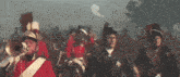 a man in a red uniform is playing a trumpet in a band