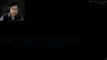 a man is playing a video game with the time of 5 am