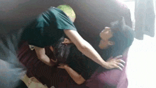 a man and woman are laying on a couch .