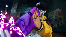 a man in a yellow and black jacket is holding a purple object .