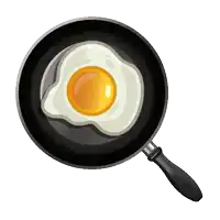 eggs are being cooked in a frying pan with a yellow egg in the middle