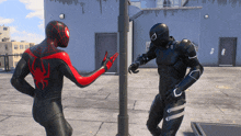 a spider-man and a black panther are standing next to each other