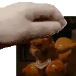 a person is petting a stuffed animal with a towel on it .