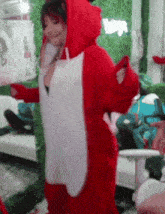 a woman in a red and white fox costume