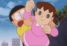 a boy and a girl are standing next to each other . the girl is wearing a pink dress .