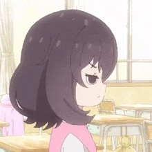 a girl with purple hair is sitting in a classroom with desks