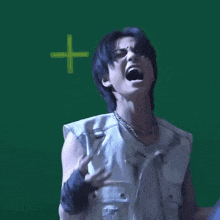 a man in a white vest and black gloves screams in front of a green background