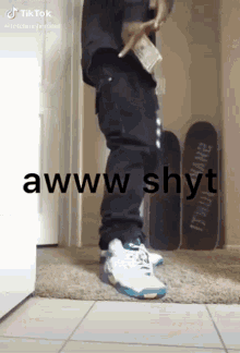 a man is standing in a hallway holding a bag of money and a skateboard .