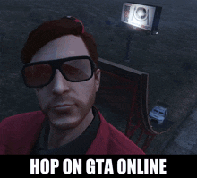 a man wearing sunglasses is standing in front of a billboard that says ' hop on gta online '