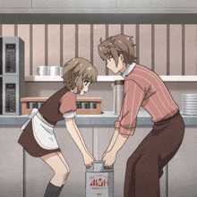 a man and a girl are standing next to a can that says asahi on it