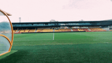 a soccer field with rodez written on the stands