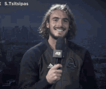 a man holding a microphone says yes