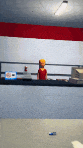 a man in a red shirt is standing at a counter in front of a no smoking sign