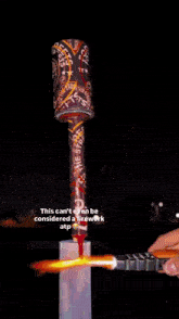 a picture of a fireworks display with the caption " this can never be considered a work at "