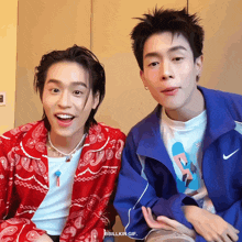 two young men are sitting next to each other and the gif says billkin gif on the bottom