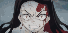 a close up of a girl with a bloody face