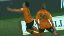 a soccer player jumps in the air in front of a sign that says maud
