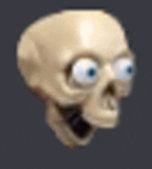 a close up of a cartoon skull with big eyes on a dark background .