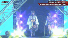 a woman in a white dress is walking on a stage with a sign that says evolution x
