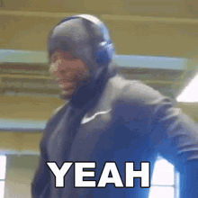 a man wearing headphones says yeah in white