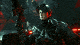 a man in a futuristic suit is holding a rifle