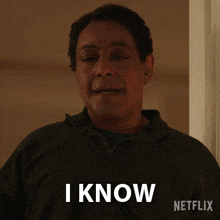 a man in a black shirt says i know