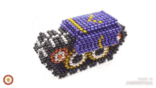 a person is playing with a toy made of beads