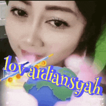 a close up of a woman 's face with the name lovarliansgah written on the bottom