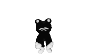 a black and white stuffed animal with a frog head is standing up on a white background .