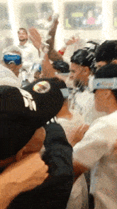 a man wearing a black hat with a white eagle on it