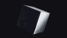 a black and white image of a broken glass object