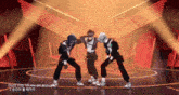 a group of people are dancing on a stage with the words " don 't stop till you get enough "