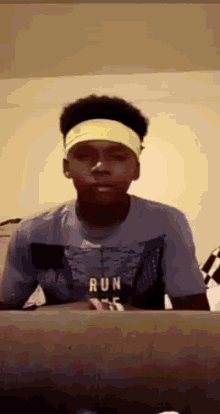 a man wearing a headband that says run