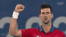 Raised Fist Novak Djokovic GIF - Raised Fist Novak Djokovic Serbia Tennis Team GIFs