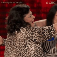 Hugging Family Feud GIF - Hugging Family Feud Family Feud Canada GIFs