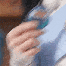 a close up of a person 's hand holding something