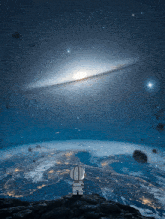 a cartoon character looking up at a galaxy over a planet