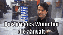 a man in a suit with the words da 's precies winnetou die aanvalt below him