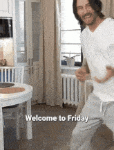 a man is dancing in a kitchen with the words welcome to friday written below him