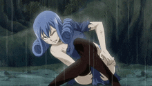 a girl with blue hair and black knee high socks is kneeling in the rain