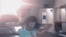 a blurry picture of a person dancing in a room