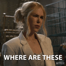 a woman in a white jacket is asking where are these
