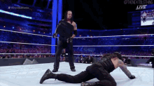 Roman Reigns The Undertaker GIF - Roman Reigns The Undertaker Chair GIFs