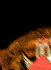 a blurry picture of a person 's face with a red background