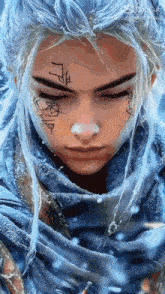 a woman with long white hair and a tattoo on her face is wearing a blue scarf .