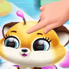 a person is touching the face of a fox with a pink flower on its head .