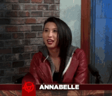 a woman in a red leather jacket with the name annabelle on the bottom