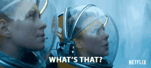 a poster for netflix shows two astronauts looking at each other